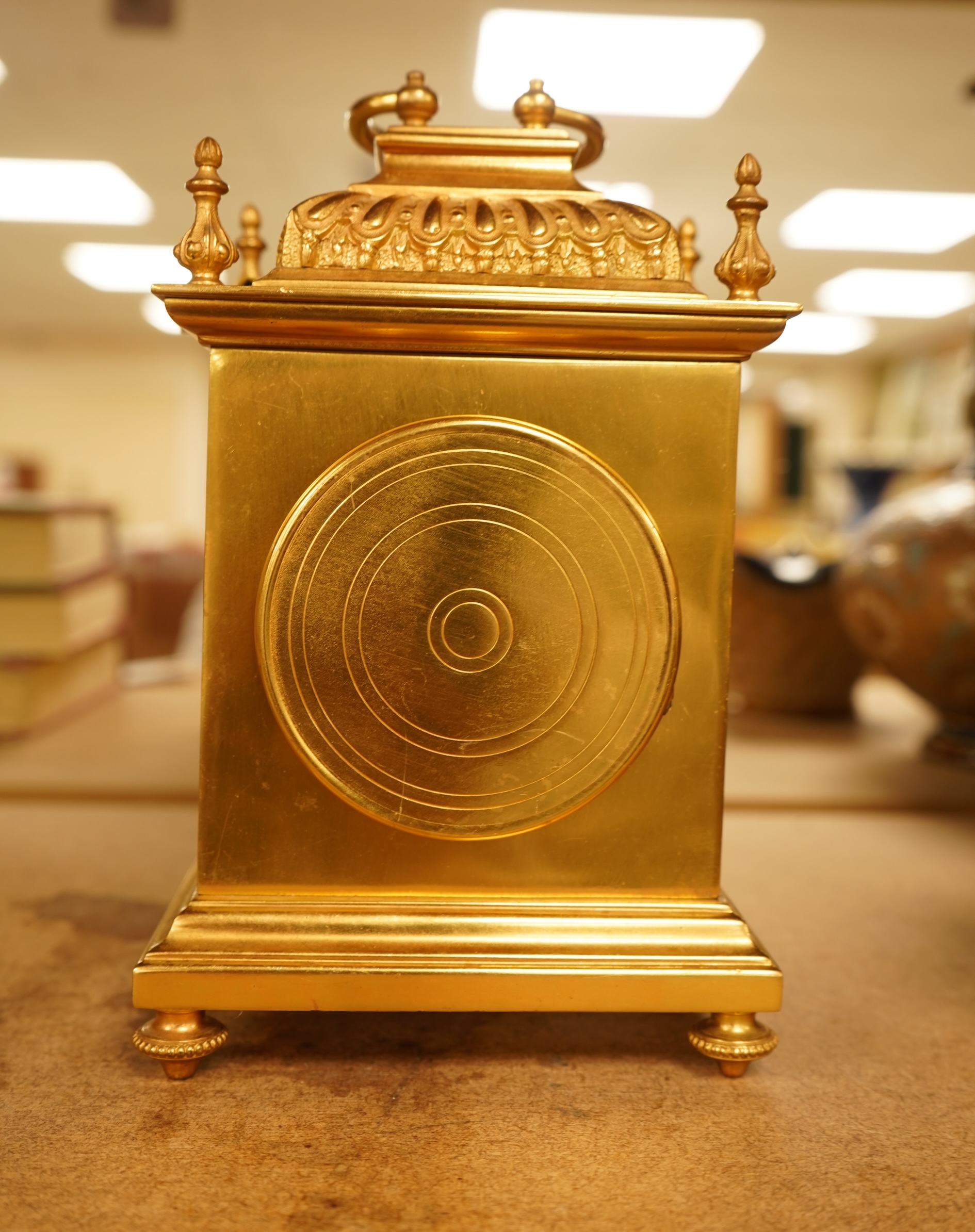 A French gilt brass timepiece with key, 19cm high